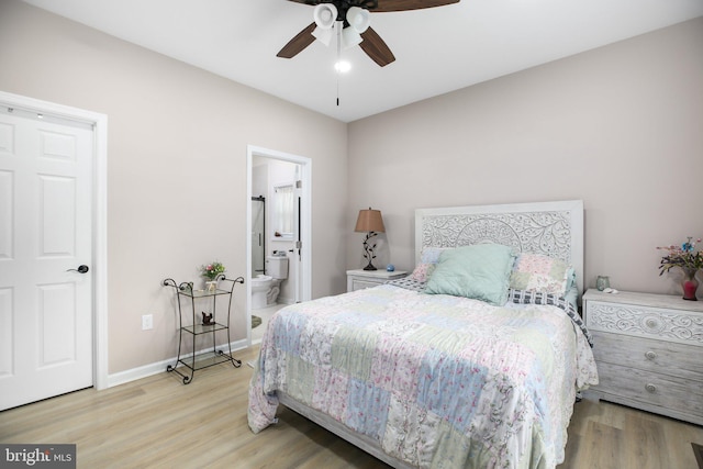 309 N Glebe Rd, Montross, VA 22520 - bedroom with wood finished floors, ensuite bathroom, baseboards, and a ceiling fan