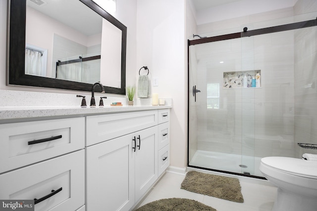 309 N Glebe Rd, Montross, VA 22520 - bathroom with a shower stall, vanity, tile patterned floors, and toilet