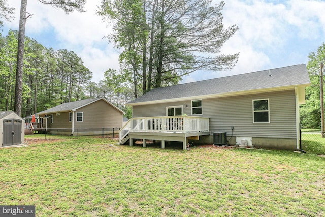 309 N Glebe Rd, Montross, VA 22520 - rear view of property featuring a wooden deck, a storage unit, an outdoor structure, and cooling unit