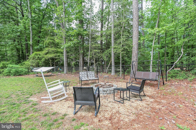 309 N Glebe Rd, Montross, VA 22520 - view of yard featuring an outdoor fire pit, fence, and a wooded view