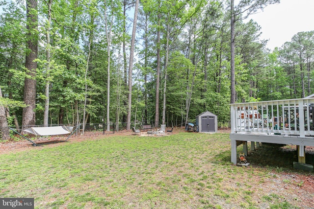 309 N Glebe Rd, Montross, VA 22520 - view of yard with a wooden deck, a shed, and an outbuilding