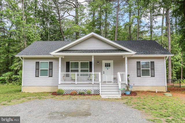 309 N Glebe Rd, Montross, VA 22520 - bungalow-style home with covered porch, roof with shingles, and view of scattered trees