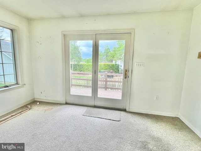 203 N Cedar St, Lititz, PA 17543 - carpeted empty room with healthy amount of natural light and baseboards