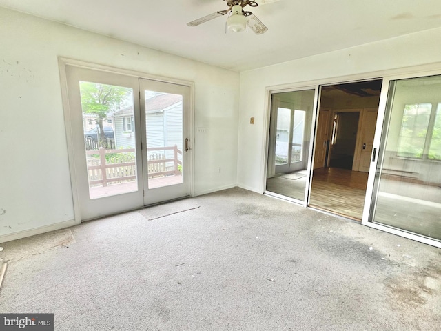 203 N Cedar St, Lititz, PA 17543 - carpeted empty room with healthy amount of natural light, a ceiling fan, and baseboards