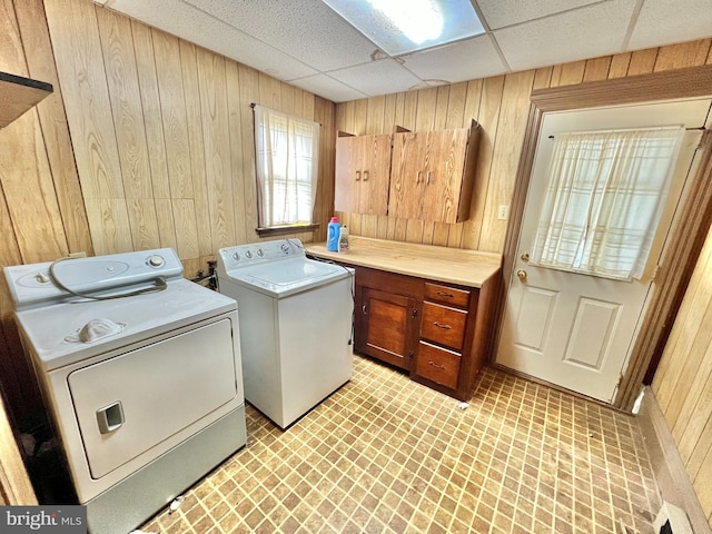 203 N Cedar St, Lititz, PA 17543 - washroom featuring separate washer and dryer, wood walls, and cabinet space