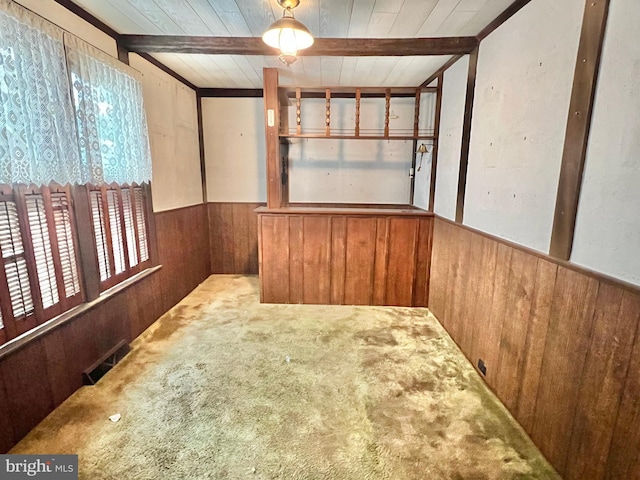 203 N Cedar St, Lititz, PA 17543 - carpeted empty room featuring wooden walls, wainscoting, and wooden ceiling