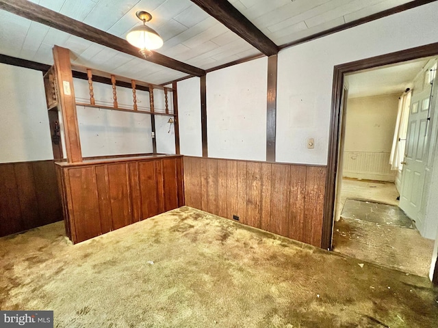 203 N Cedar St, Lititz, PA 17543 - spare room with wooden walls, a wainscoted wall, beam ceiling, carpet flooring, and wooden ceiling
