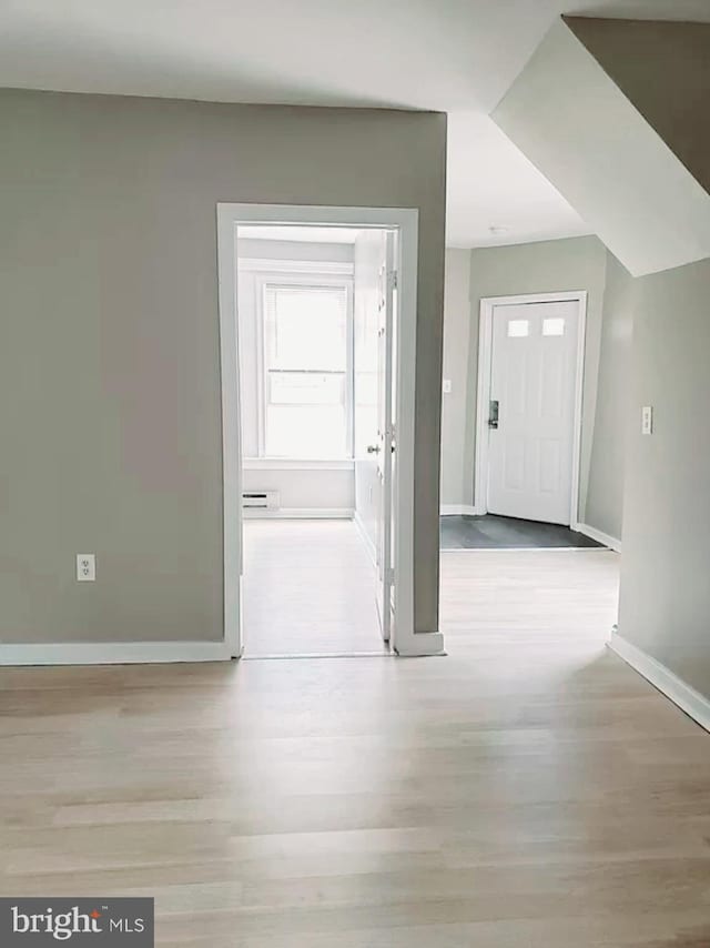 2067 W Stella St, Philadelphia, PA 19132 - foyer entrance featuring baseboards and wood finished floors