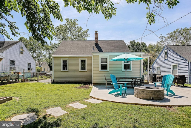 1906 Jackson Rd, Baltimore, MD 21222 - rear view of property featuring an outdoor fire pit, a patio, and a chimney