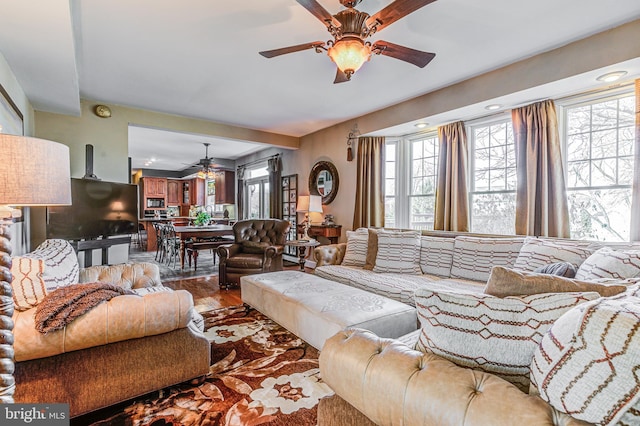 7140 Poole Jones Rd, Frederick, MD 21702 - living area featuring a ceiling fan, healthy amount of natural light, and wood finished floors