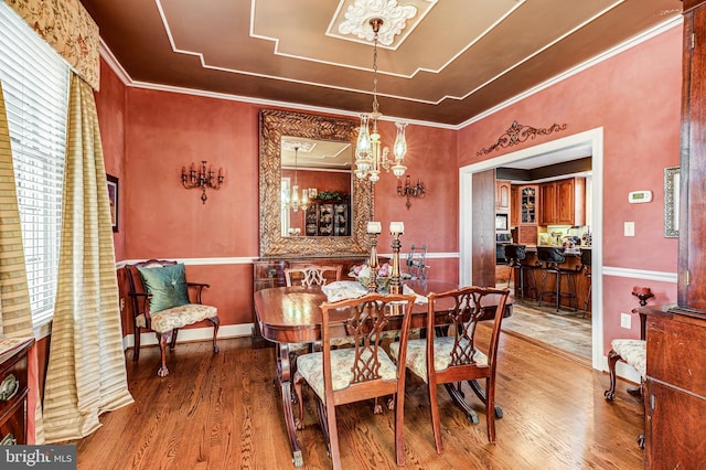 7140 Poole Jones Rd, Frederick, MD 21702 - dining space with wood finished floors, a chandelier, and ornamental molding
