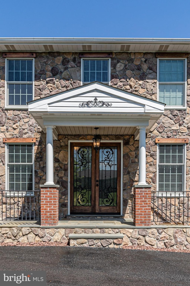 7140 Poole Jones Rd, Frederick, MD 21702 - view of exterior entry with stone siding and covered porch