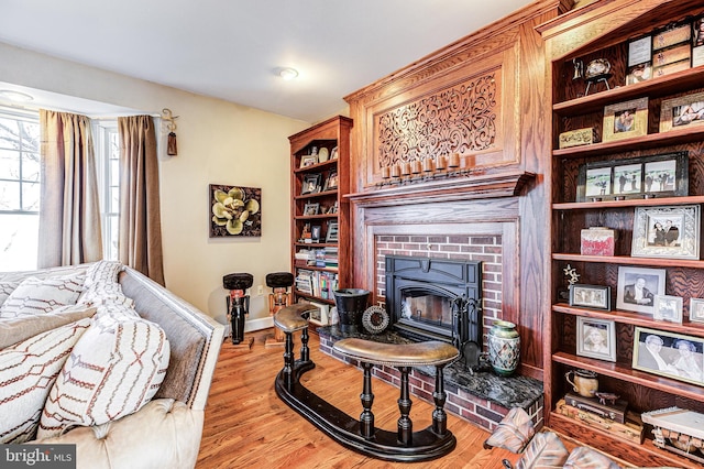 7140 Poole Jones Rd, Frederick, MD 21702 - living room with a fireplace, light wood-type flooring, and baseboards