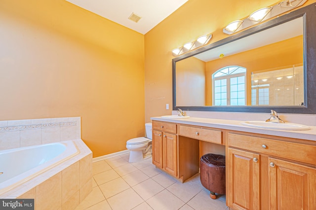 bathroom with tile patterned floors, a garden tub, double vanity, toilet, and a shower