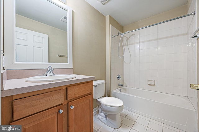full bath with tile patterned floors, toilet, vanity, and bathtub / shower combination
