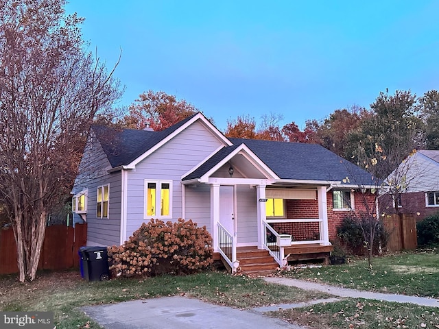 1305 S Buchanan St S, Arlington, VA 22204 - view of front of home with a shingled roof and covered porch