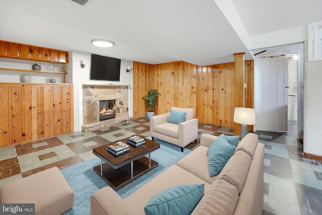 1305 S Buchanan St S, Arlington, VA 22204 - living area featuring tile patterned floors, wood walls, and a fireplace