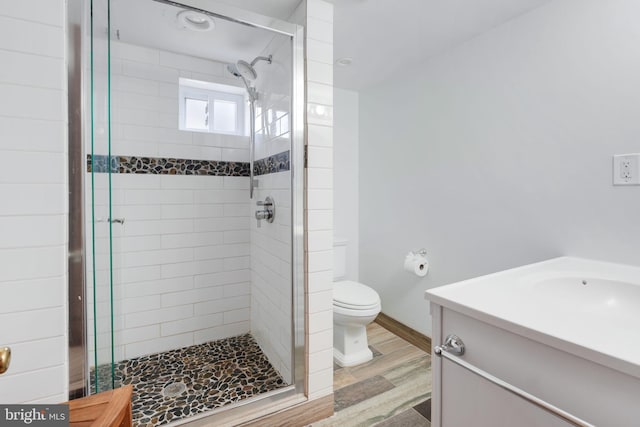 1305 S Buchanan St S, Arlington, VA 22204 - bathroom featuring a stall shower, toilet, wood finished floors, and vanity