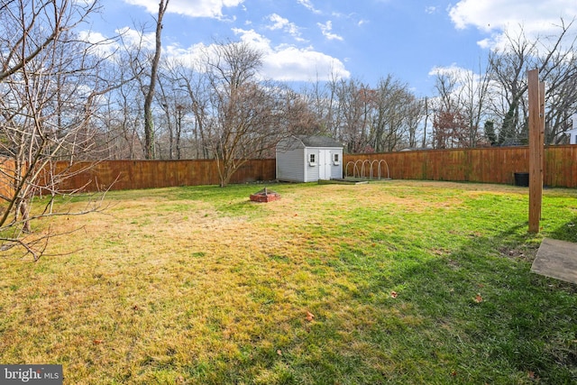 1305 S Buchanan St S, Arlington, VA 22204 - view of yard with a storage unit, an outbuilding, and a fire pit
