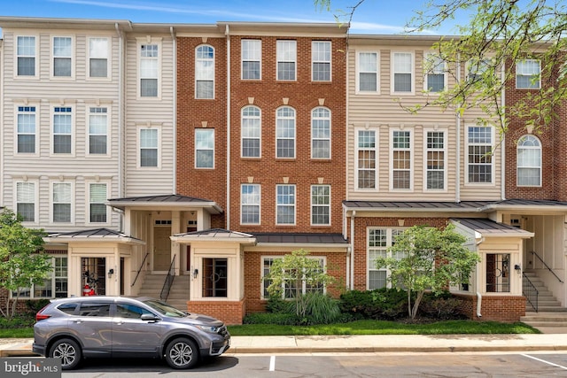 6055 Wicker Ln Unit 127, Centreville, VA 20121 - multi unit property featuring a standing seam roof, brick siding, and metal roof