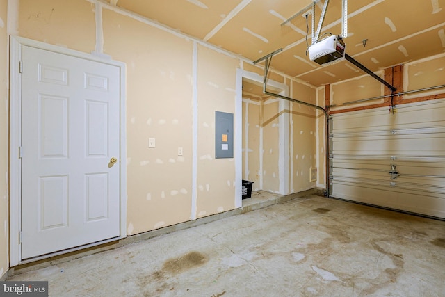 6055 Wicker Ln Unit 127, Centreville, VA 20121 - garage featuring electric panel and a garage door opener