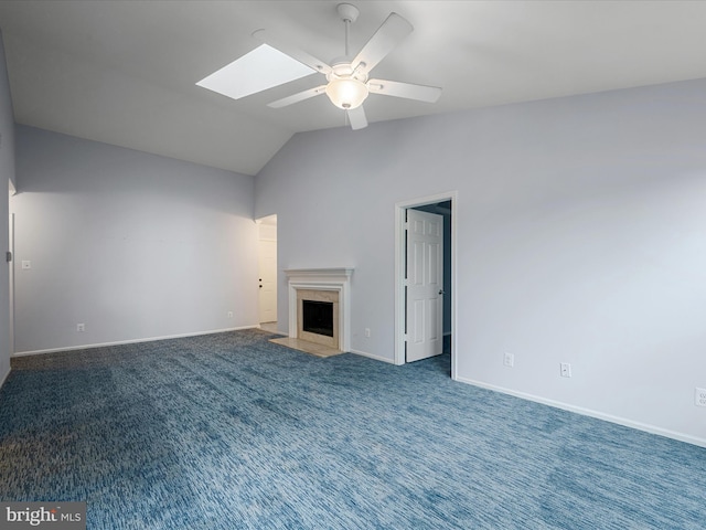 1110 Huntmaster Ter NE Unit 302, Leesburg, VA 20176 - unfurnished living room with ceiling fan, vaulted ceiling, baseboards, a premium fireplace, and a skylight