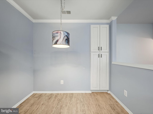 1110 Huntmaster Ter NE Unit 302, Leesburg, VA 20176 - unfurnished dining area with light wood-type flooring, baseboards, and ornamental molding