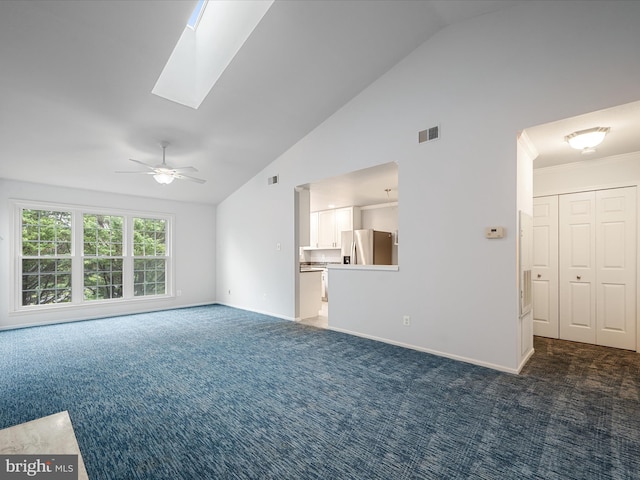 1110 Huntmaster Ter NE Unit 302, Leesburg, VA 20176 - unfurnished living room with carpet floors, a ceiling fan, baseboards, high vaulted ceiling, and a skylight