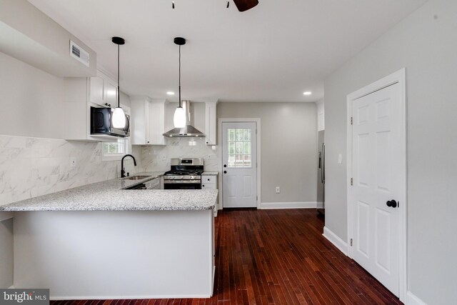 3411 Roselawn Ave, Baltimore, MD 21214 - kitchen featuring stainless steel range with gas stovetop, wall chimney range hood, a sink, a peninsula, and backsplash