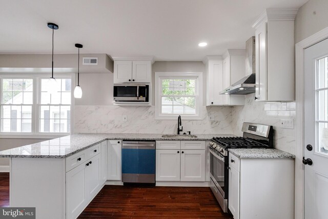 3411 Roselawn Ave, Baltimore, MD 21214 - kitchen featuring stainless steel appliances, wall chimney exhaust hood, a sink, a peninsula, and dark wood-style flooring