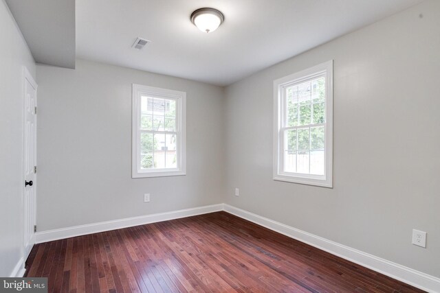3411 Roselawn Ave, Baltimore, MD 21214 - spare room featuring dark wood-style floors and baseboards