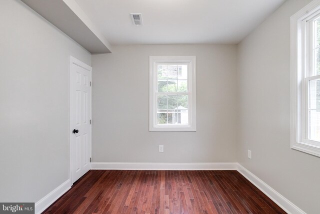3411 Roselawn Ave, Baltimore, MD 21214 - spare room featuring dark wood finished floors, healthy amount of natural light, and baseboards