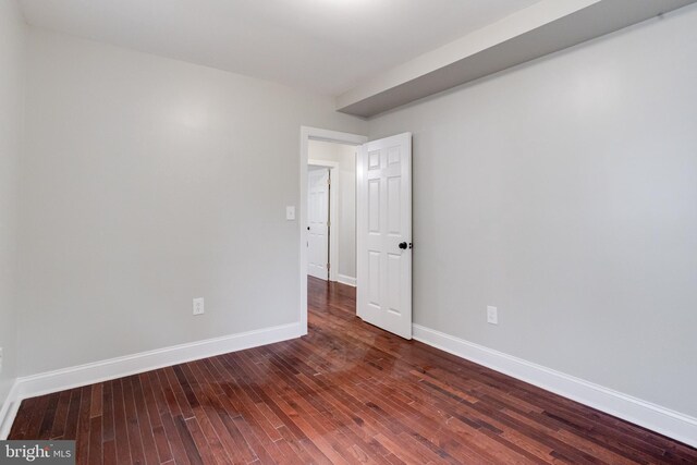3411 Roselawn Ave, Baltimore, MD 21214 - spare room with baseboards and dark wood-type flooring