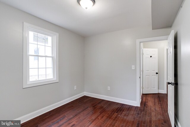 3411 Roselawn Ave, Baltimore, MD 21214 - spare room with dark wood-style flooring and baseboards