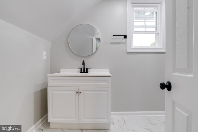 3411 Roselawn Ave, Baltimore, MD 21214 - bathroom featuring marble look tiles, vanity, baseboards, and lofted ceiling