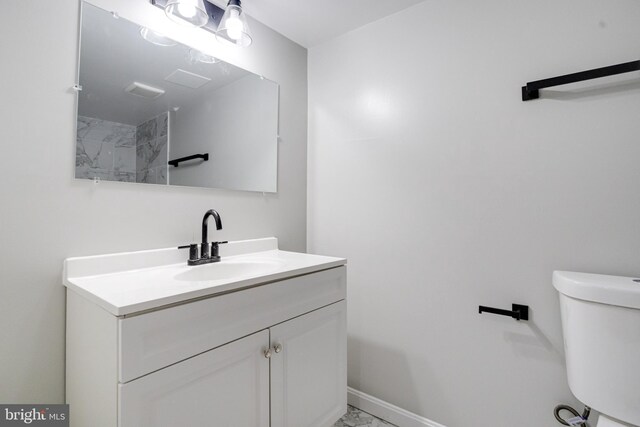 3411 Roselawn Ave, Baltimore, MD 21214 - bathroom featuring vanity, toilet, marble finish flooring, and baseboards