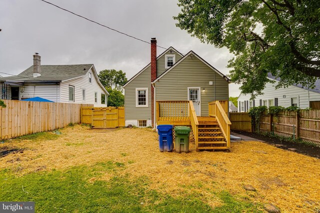 3411 Roselawn Ave, Baltimore, MD 21214 - back of property with a wooden deck and a chimney