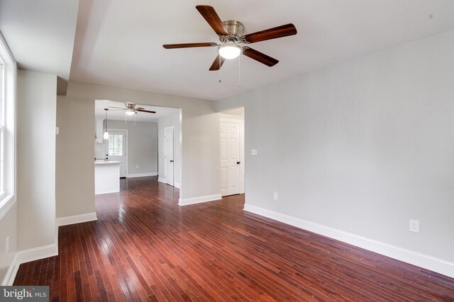 3411 Roselawn Ave, Baltimore, MD 21214 - spare room with a ceiling fan, dark wood-type flooring, and baseboards