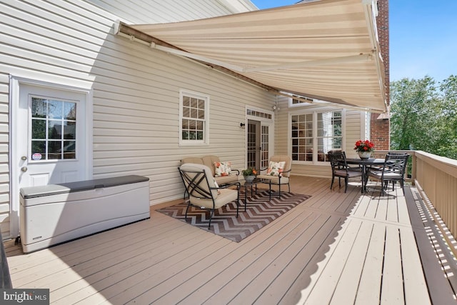 wooden deck with outdoor dining space