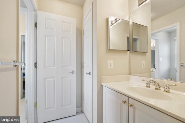 bathroom with tile patterned flooring and vanity