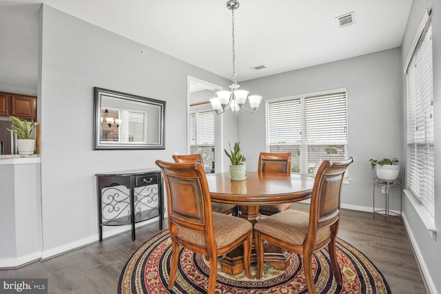 8960 Fascination Ct Unit 414, Lorton, VA 22079 - dining area with a chandelier, dark wood-style flooring, and baseboards
