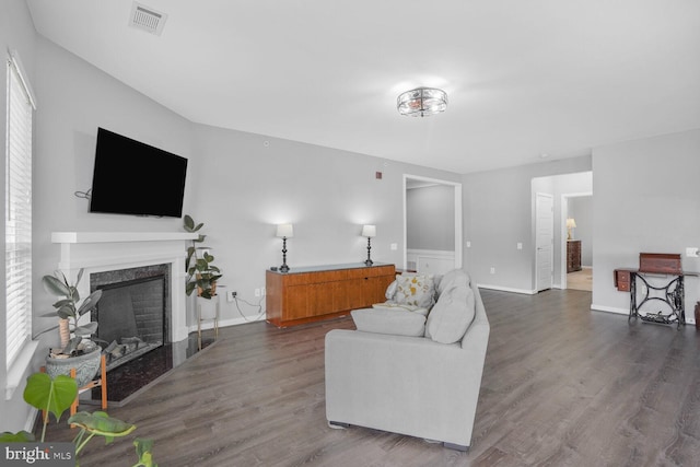 8960 Fascination Ct Unit 414, Lorton, VA 22079 - living room featuring wood finished floors, a high end fireplace, and baseboards