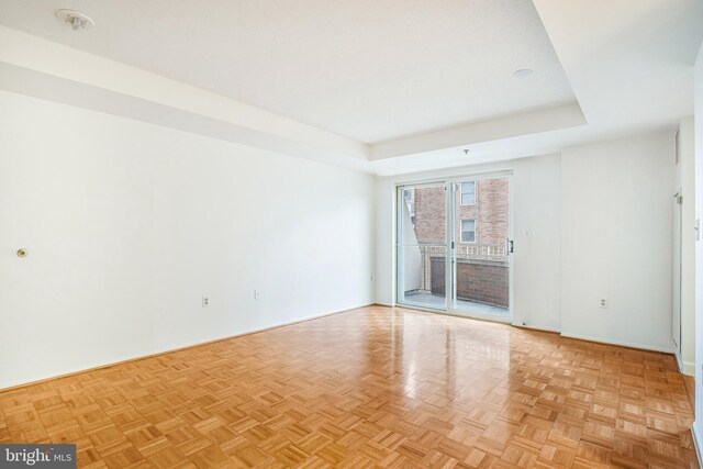 900 N Taylor St Unit 1105, Arlington, VA 22203 - unfurnished room featuring baseboards and a tray ceiling