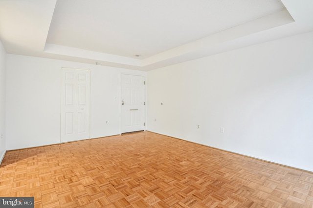 900 N Taylor St Unit 1105, Arlington, VA 22203 - spare room featuring a raised ceiling and baseboards