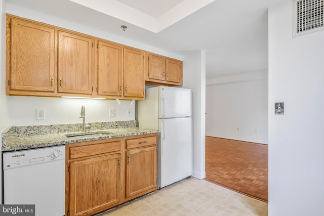 900 N Taylor St Unit 1105, Arlington, VA 22203 - kitchen featuring white appliances, a sink, and light stone counters