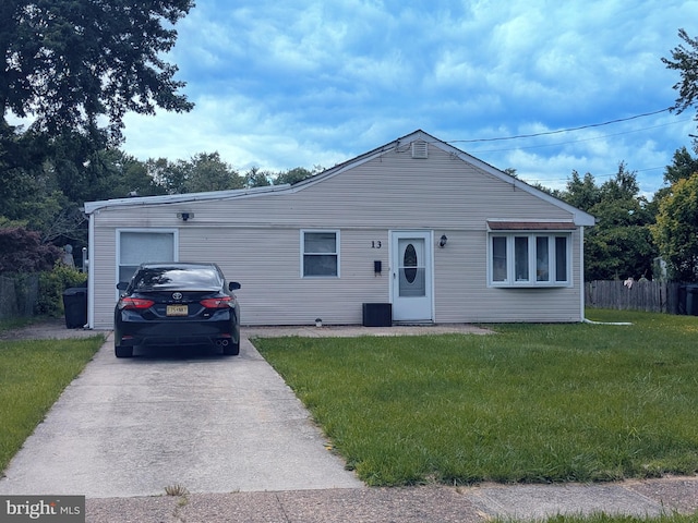 13 Dorset Dr, Ewing, NJ 08618 - view of front of house featuring a front yard, concrete driveway, and central AC unit