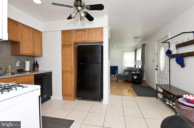 13 Dorset Dr, Ewing, NJ 08618 - kitchen with black appliances, a ceiling fan, light tile patterned floors, and decorative backsplash
