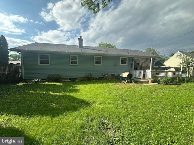 back of property featuring a wooden deck