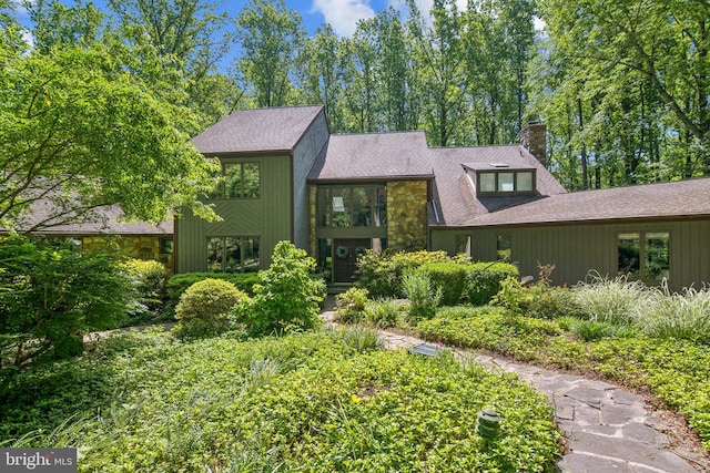 113 Sparrow Hawk Ln, Chadds Ford, PA 19317 - mid-century inspired home featuring a chimney, stone siding, and a shingled roof