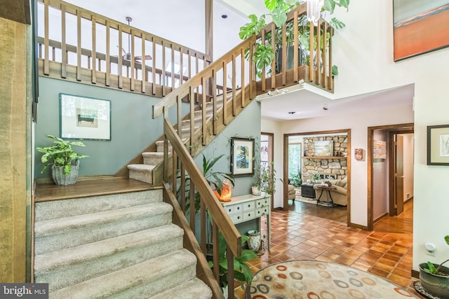 113 Sparrow Hawk Ln, Chadds Ford, PA 19317 - stairway featuring tile patterned floors and a high ceiling